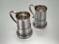A near pair of late 18th early 19thc Sheffield plated tapered cylinder tankards with S scroll