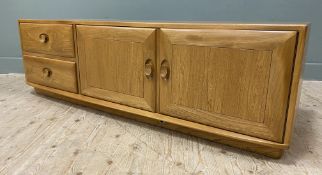 A contemporary elm sideboard by Ercol, rectangular top over two short drawers and twin cupboard