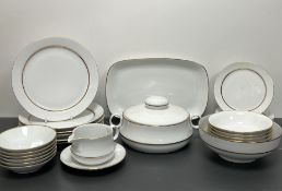 An Eschenbach part dinner service with gilt border comrpising six dinner plates, six side plates,