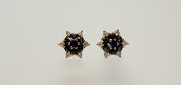 A pair of Thai 14ct gold stud cluster earrings set seven round cut sapphires approximately 1.3ct