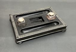 A papier mache desk stand by Jenners & Bettridge, with inlaid border to top, and two glass