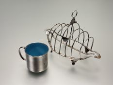 A George III John Emes London silver six devision navette shaped toast rack with ring to top and