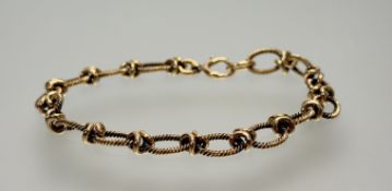 A 9ct cast gold rope pattern oval link bracelet with ring fastening: d. x 8cm 12.55