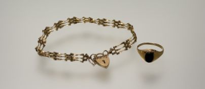 A 9ct gold gate link chain bracelet with heart shaped padlock and sefety chain: d. x 8cm 3.82g and a