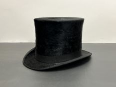 A Kerr and McKenzie of Hawick top hat with black silk pile and cream and silk interior (interior