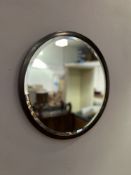 A mahogany-framed circular wall mirror with bevelled mirror plate (d. 48.5cm)