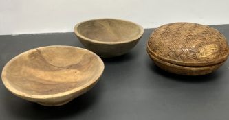 A turned wooden carved bowl with cover, carved with a rattan pattern (d. 27cm), together with a pair