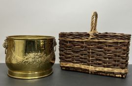 A brass embossed planter with twin lion-head handles and embossed foliate decoration to body (h.