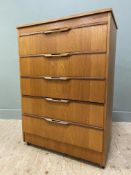 A mid-century teak chest of drawers, by Sakol, fitted five graduated drawers to front, raised on