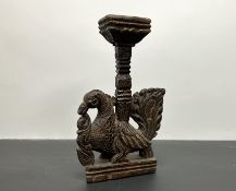 An Indian hand carved sculpture/lamp stand with intricately carved bird to base (h. 38cm)