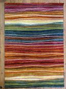 A modern machine-made carpet, with bright multi-coulour banded stripes: l.x 230cm w.x 160cm