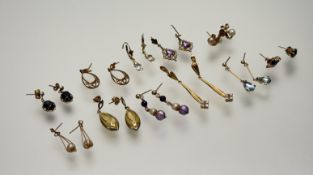 A collection of eleven pairs of 9ct gold and yellow earrings to include a pair of 9ct gold drop