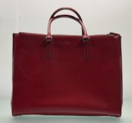 Anya Hindmarch, an Ebury tote in high gloss red, two top handles, tassels to zip pulls, chrome