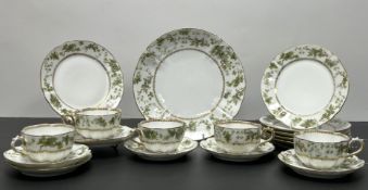 An M Reddon Limoges tea service decorated with a green Ivy border flanked by gilt rims, the