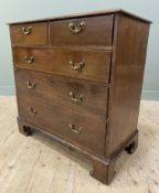 A George III mahogany chest of drawers, rectangular moulded top, fitted with two short over three