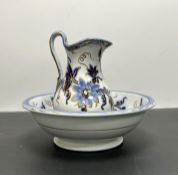 An English Edwardian china jug and ewer with blue foliate decoration complete with gilt detailing,