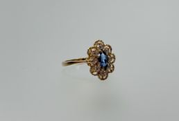 A 9ct gold ring set navette shaped zircon within a surround of eight cubic zirconia P 3.23g