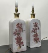 A large pair of ceramic lustreware table lamps of shouldered form, decorated with hibiscus flowers