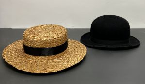 An Ingram of Glasgow black bowler hat with black ribbon band and leather interior band (interior