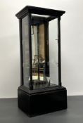 An early 20thC table top display cabinet of rectangular form with glass panels to front/side and