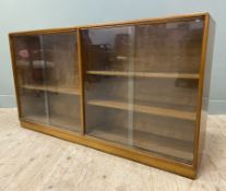 A Mid-century Teak Sideboard, rectangular top with curved edges, with two twin-pannel glazed door to