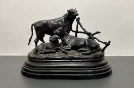 After Jules Moigniez, a bronze figure goup of a bull, a cow and a calf, signed to base (h. 24cm x l.