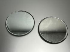 A circular frameless mirror plateau with bevelled edge (d. 26cm), together with a similar mirror