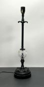 A contemporary Art Nouveau style table lamp with moulded floral decoration to top and cut glass