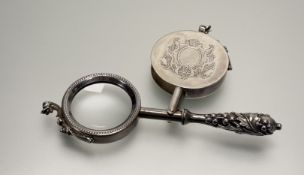 A late 19thc early 20thc 800 standard continental white metal looking glass with dolphin surmounts