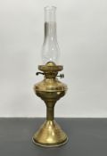 A late 19th/early 20thC brass oil lamp with clear glass chimney shade (h. 56cm)