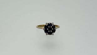 A Thai 18ct gold cluster ring set six sapphires approximately 0.89ct with six diamond points N 3.17g