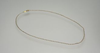 A 18ct gold oval link chain necklace with ring fastening: l. x 221.5cm 2.1g