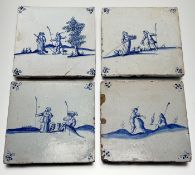 A collection of four blue and white delft tiles, each depicting a various figural scenes with