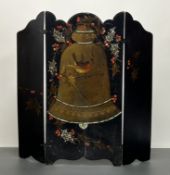 A black-lacquered Victorian triptych screen featuring a central panel adorned with festive scene