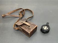 A WWII T.G & Co Ltd, London, No. B273841, marked 1944, MKII, within a brown leather carry case (a/f)