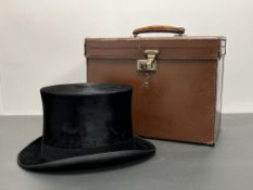 An early/mid 20thC Lincoln Bennett & Co black silk top hat, with cream silk lining with tan
