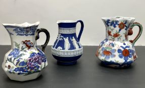 An Ironstone jug decorated in the Imari palette with foliate deocation to body and shaped serpent