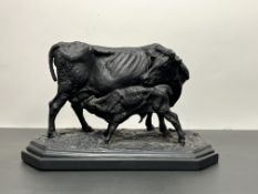 After P.J. Mene, a bronze sculpture of a cow and feeding calf mounted on an octagonol tepered