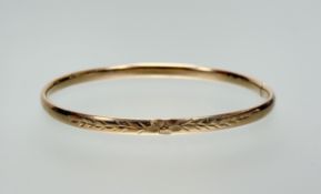 A 9ct gold hollow stiff bangle: d. x 6cm 4.92g