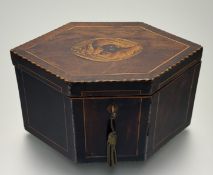 A George III satinwood and mahogany tea caddy in hexagonal form, the cover with oval seashell