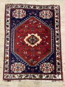 A hand-knotted Persian Shiraz rug, central hexagonal panel with medallion surrounded by stylized