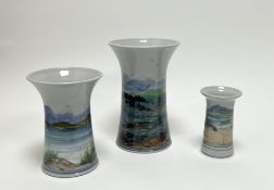 A graduated set of three Highland Stoneware vases of trumpet-form with varying decoration, one