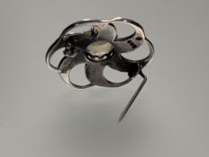 A John Hart Iona Edinburgh silver Celtic scroll brooch set central facet cut circualr citrine