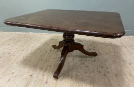 A Victorian mahogany snap-top breakfast table, rectangular moulded top with rounded edges raised