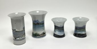 A collection of Highland Stoneware vases comprising a pair of short fluted vases decorated with