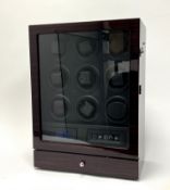 A Watch Winder box for nine automatic watches with storage drawer, displayed within a wooden case