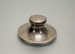 A George V London silver presentation capstan inkwell of weighted circular form with engraved