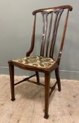 A late 19th/ early 20th century Art Nouveau chair by Liberty of London, pierced splat back over