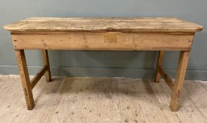 An early 20th century country house pantry table, plank top raised on square supports and