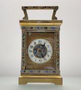 An Edwardian champleve gilt brass four glass table clock with white enamel dial and roman numerals
